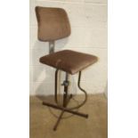 A 1970's operator's painted metal adjustable chair.