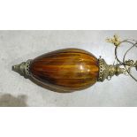 A metal and amber glass light fitting of teardrop shape, 61cm high.