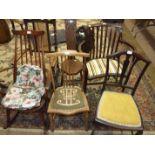 An Edwardian inlaid mahogany kidney-shaped chair, an Ercol small rocking chair and others.