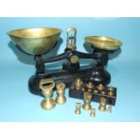 A set of metal and brass weighing scales by Libra Scale Company, together with brass weights.