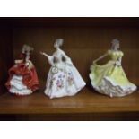 A collection of three Royal Doulton figurines, 'Top Of The Hill' HN1834, 'Diana' HN2468 and '