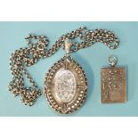 A Victorian silver locket pendant, Birmingham 1882, on later belcher-link chain and a "Sweet Pea