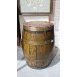 An oak and copper-bound barrel stamped Simmonds, Devonport, 55cm high.