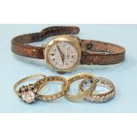 A 9ct-gold-cased wrist watch on leather strap and four 9ct gold rings set synthetic stones, total