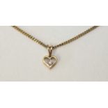 A small 18ct gold heart-shaped pendant set diamond point, on 18ct gold chain, 2.4g, boxed with