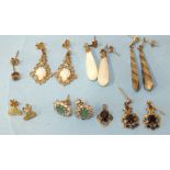 A pair of 9ct gold opal and filigree earrings, a pair of garnet earrings, five other pairs of