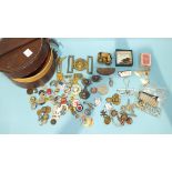 A quantity of military buttons, buckle, coins and badges, in a leather collar box.