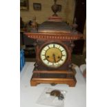 An Edwardian stained wood architectural mantel clock, 47cm high.