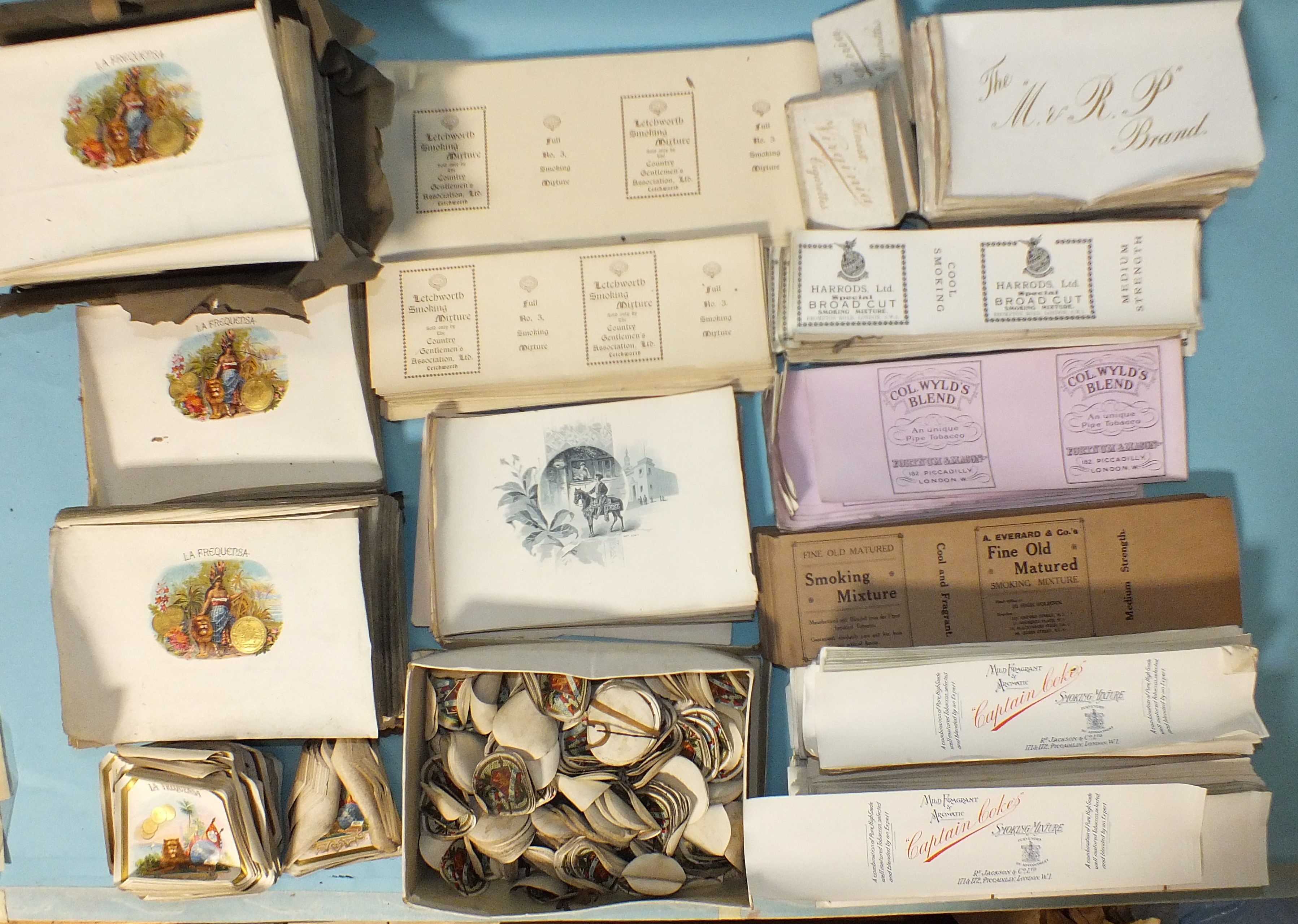 A large collection of tobacco labels: Harrods Ltd, Fortnum & Mason, R Jackson & Co Ltd and others.