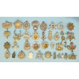 A collection of thirty-five various military badges, including a silver County of London Yeomanry