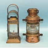 A copper and brass 'anchor' light, 27cm high and another four-glass oil lamp, (2).