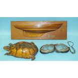 A taxidermied tortoise, a modern half-boat model 'Aquarius 2' and a pair of early motoring