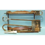 A stained wood gun rack, a Gibbs Ltd Bristol oil bottle, gun cleaning equipment, a Shell petrol