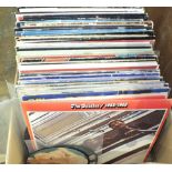 A small collection of LP records, including laser discs.