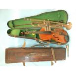 A full-sized violin in case, with bow, A Pan American Elkhart Ind, USA trumpet, an Acme keeper's