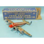A Marx tinplate no. 858 'Sky Cruiser' friction-powered four-engine Passenger Plane, with siren,