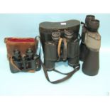 A pair of modern 12-36x70 binoculars, with zoom 57m-1000m, in case and two other pairs of