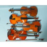 A child's Guarnerius copy violin (a/f) and three other children's violins, (one a/f), (all