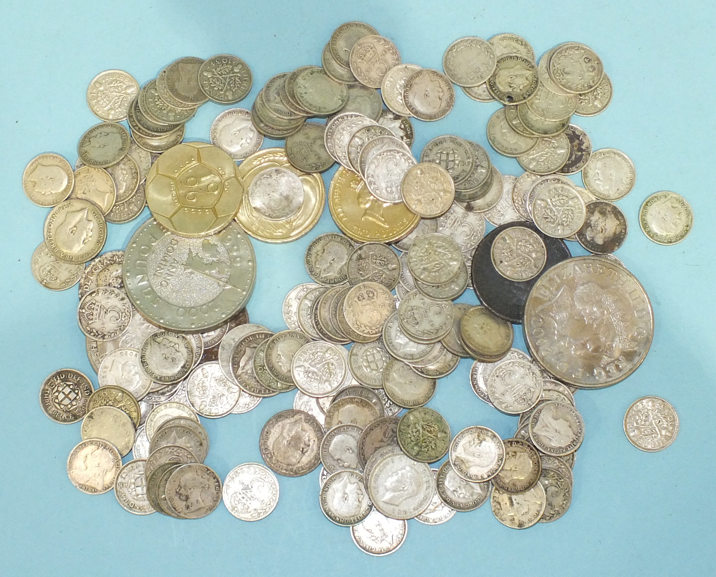 A collection of various British and world coinage, including approximately 170 pre-1947 silver 3d,