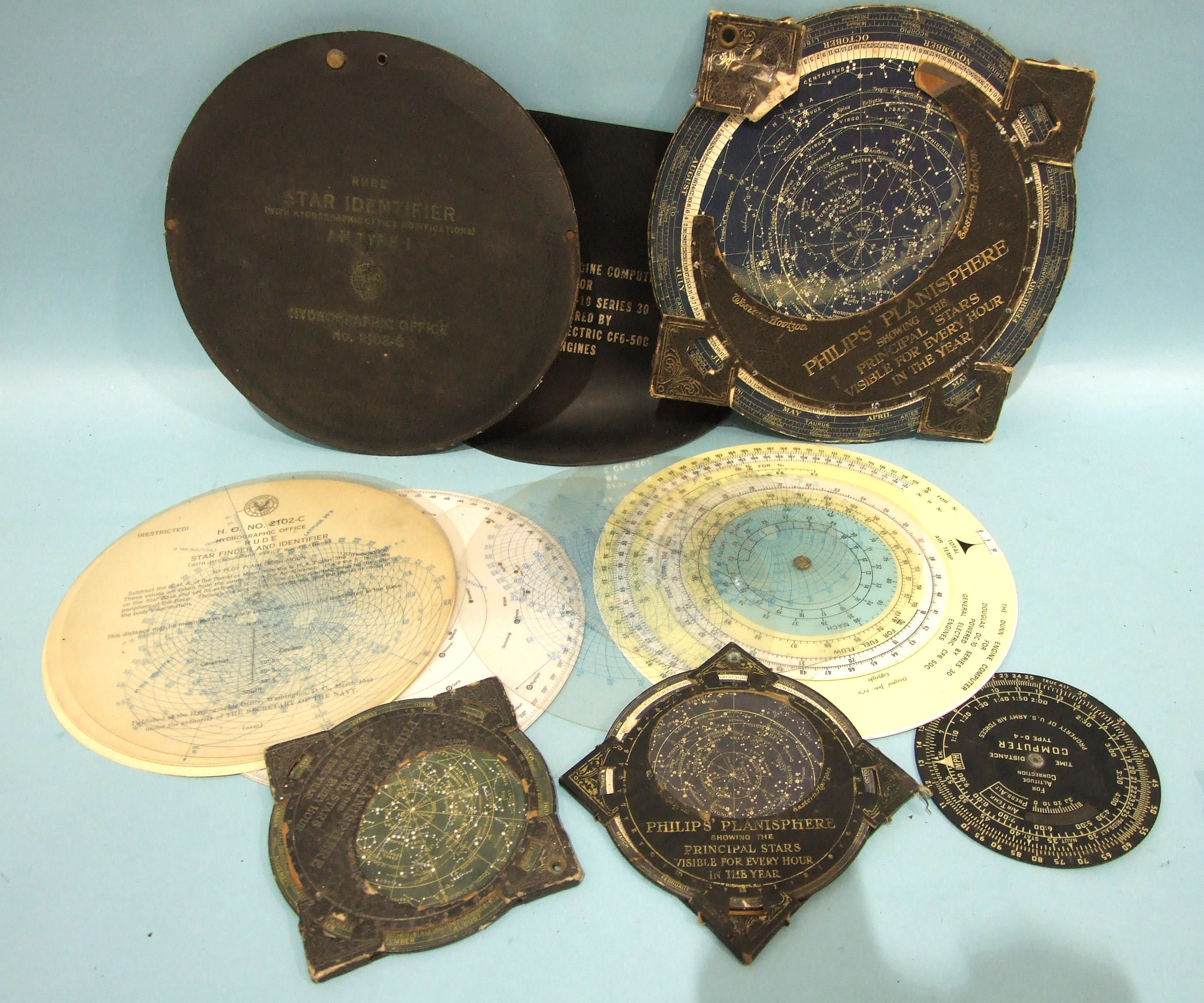 A Philips Planisphere, 32cm (damaged), two smaller Philips Planispheres, 17cm, a Hydrographic Office