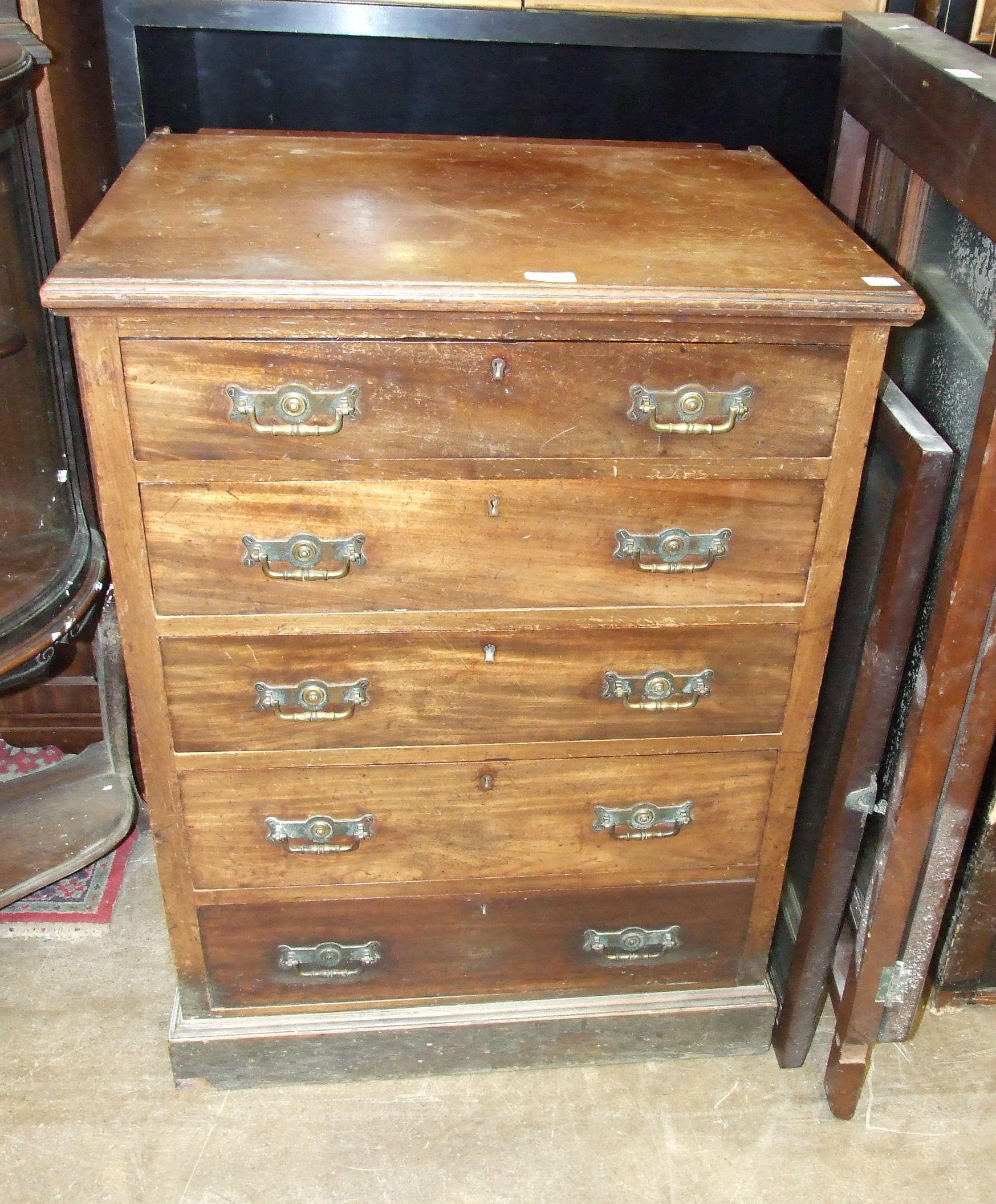 An Edwardian small dressing chest of five drawers, 67cm, the chest 67cm wide, 91cm high.