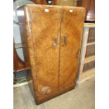 A 1930's 'Palatial Furniture' burr walnut gentleman's small wardrobe with fitted interior, 137cm