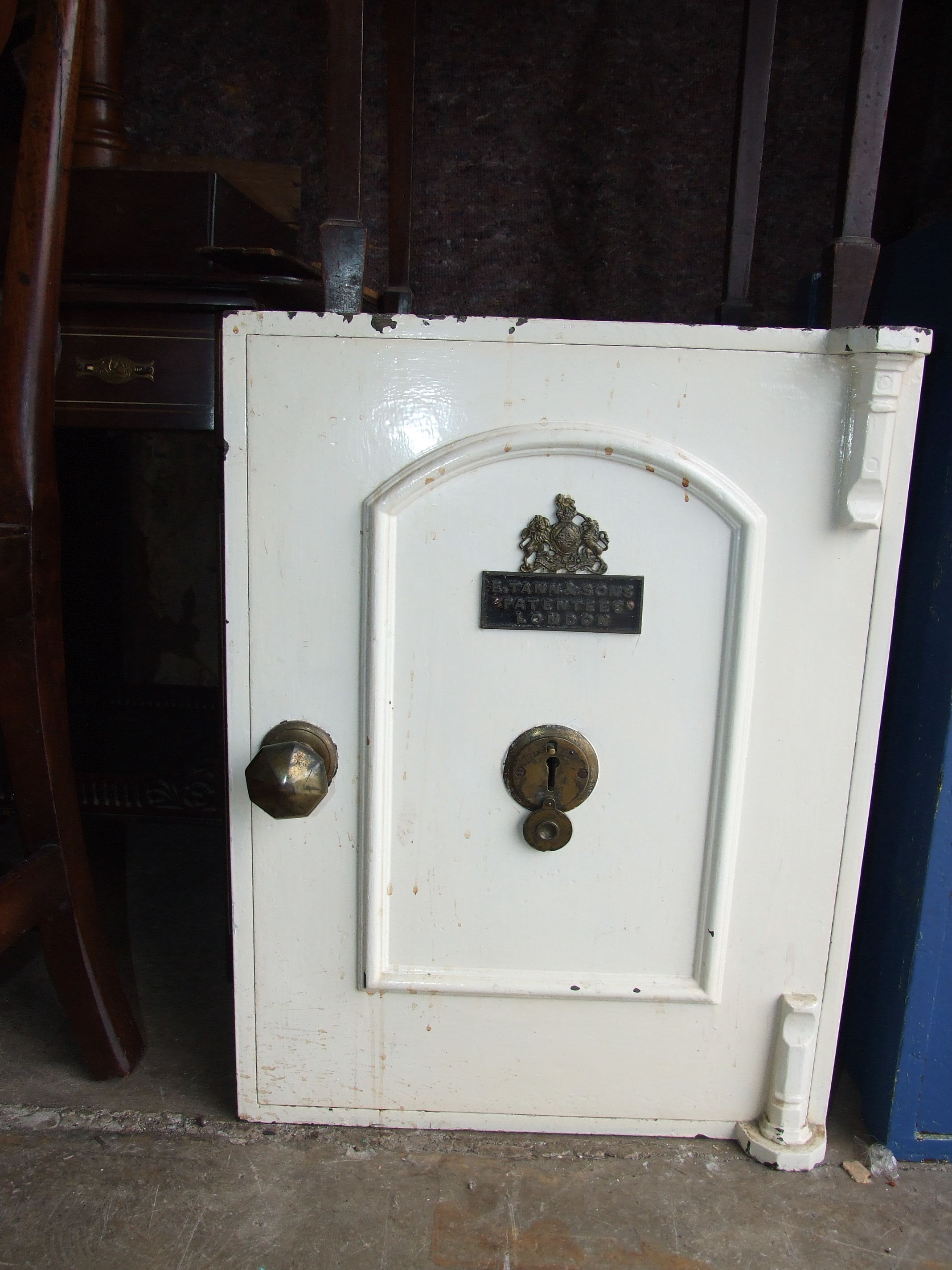 A smaller iron safe by E Tann & Sons, London, with key, 60cm high, 45cm internal.