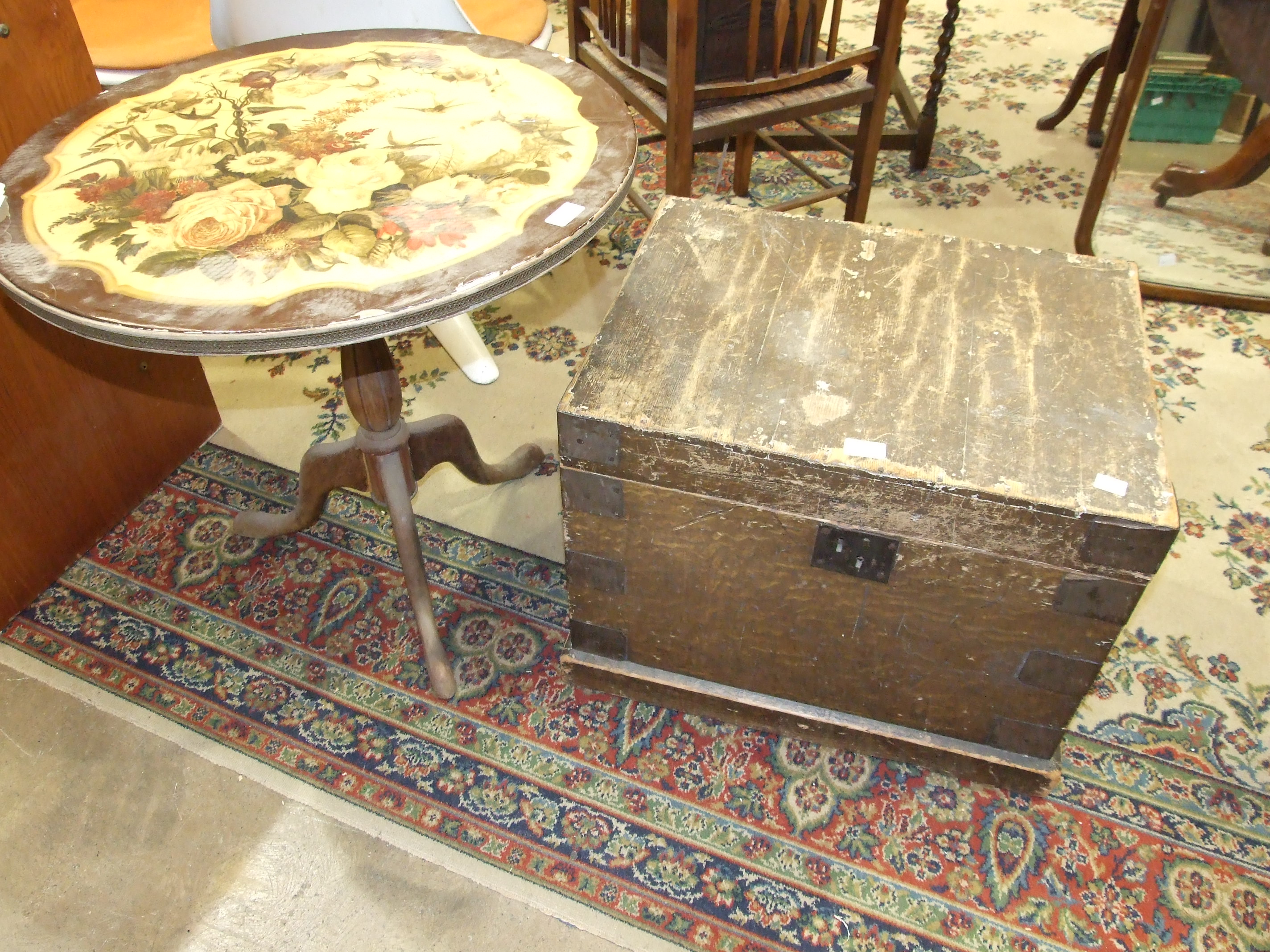 A stained pine metal-bound rectangular box, 58cm wide and a circular occasional table bearing