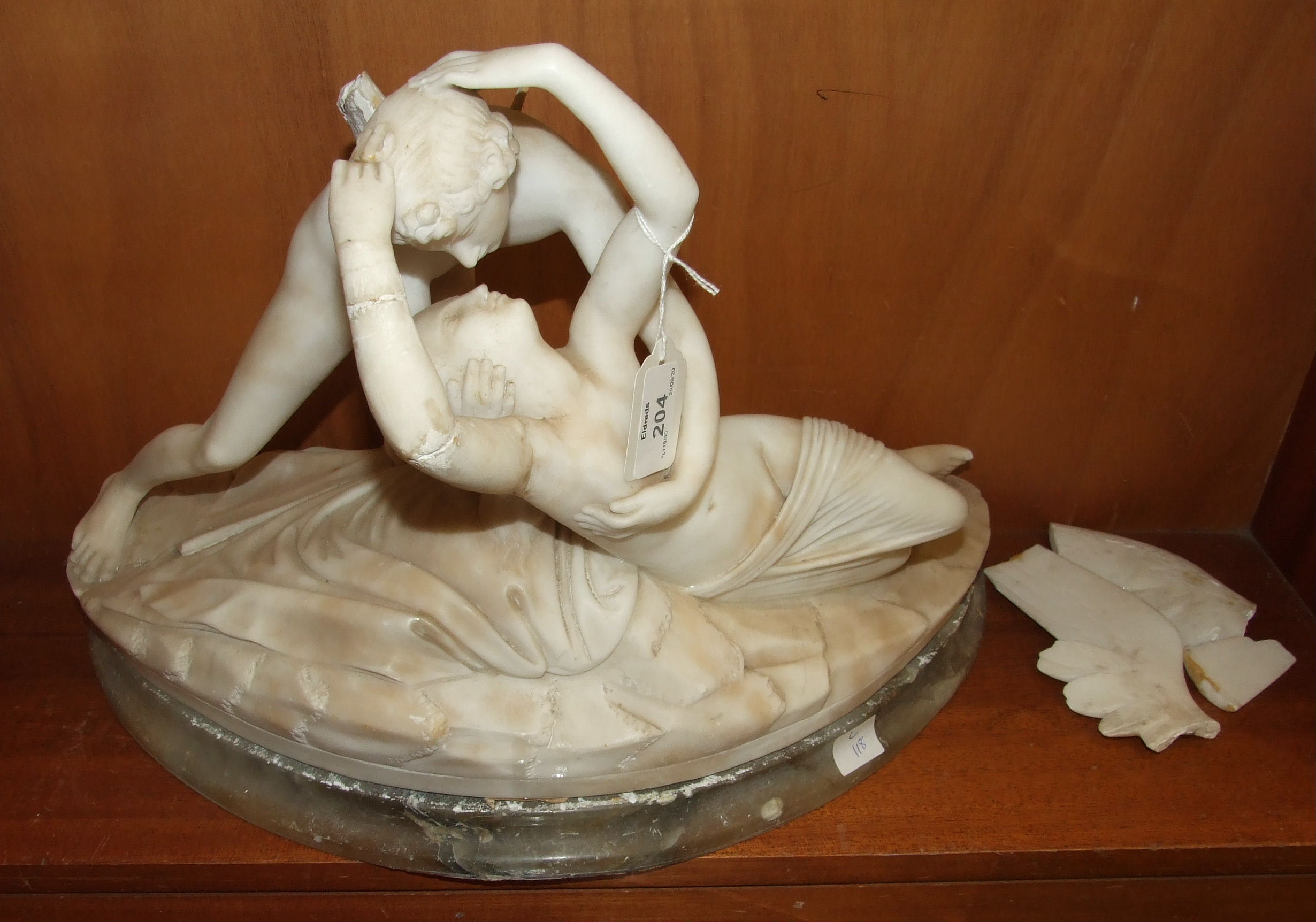 An alabaster sculpture 'Psyche revived by Cupid's kiss', (damages).