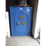 An iron safe by George Titterton, Birmingham, with key, 71cm high, 54cm internal.