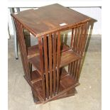 A stained wood revolving bookcase, the top 42cm square, 74cm high.