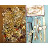 Two Swatch wrist watches, other watches and a quantity of costume jewellery.