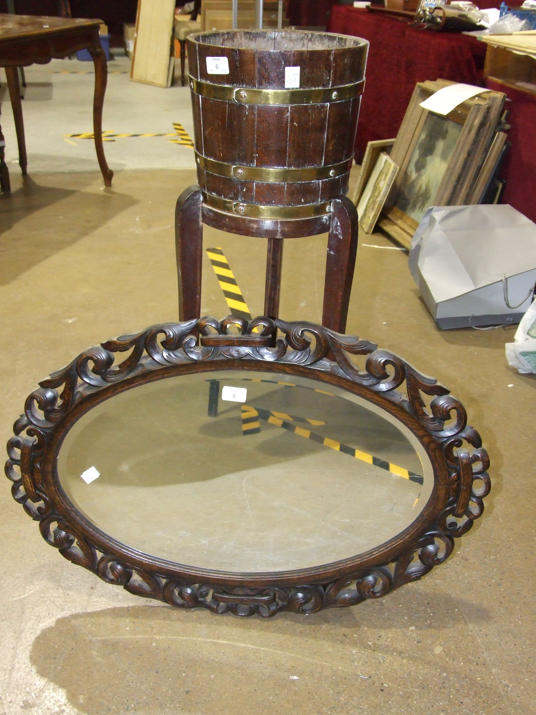 An oak brass-bound coopered planter on stand, 97cm high, 26cm diameter and a carved oak oval frame