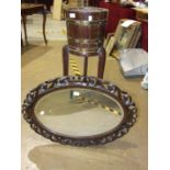An oak brass-bound coopered planter on stand, 97cm high, 26cm diameter and a carved oak oval frame