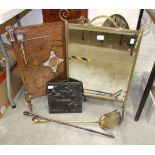 A brass-framed mirrored fire screen, a copper fire screen, a metal plaque and other metal ware.