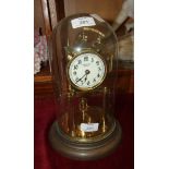 A brass 400-day clock, the dial marked E Bowden & Sons, Plymouth, under glass dome, 29cm high
