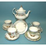 A Royal Albert ceramic teapot and four Queen Anne China trios, all hand-painted with Western