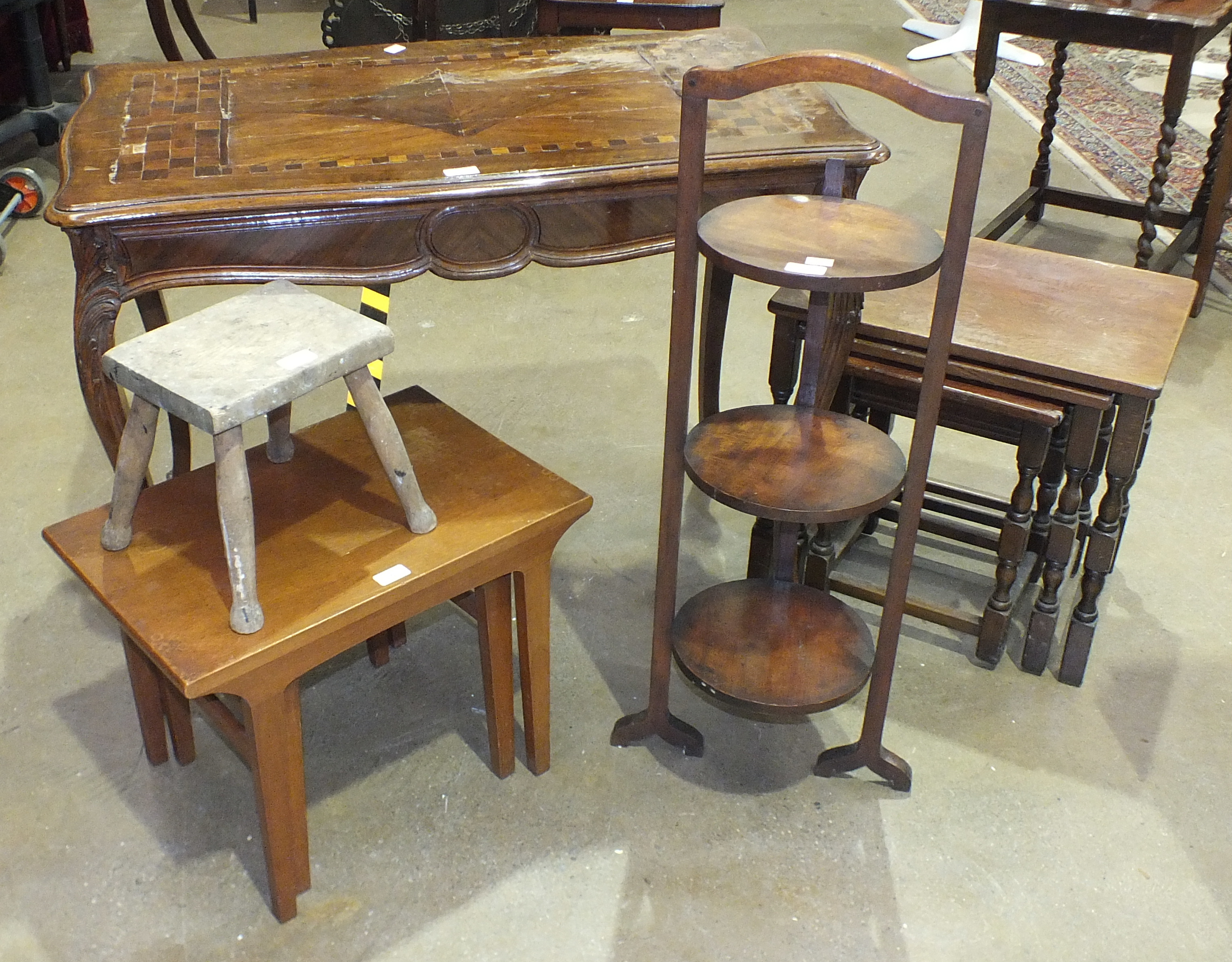 A pair of modern teak coffee tables, 54 x 36cm max, a nest of three stained wood tables and other