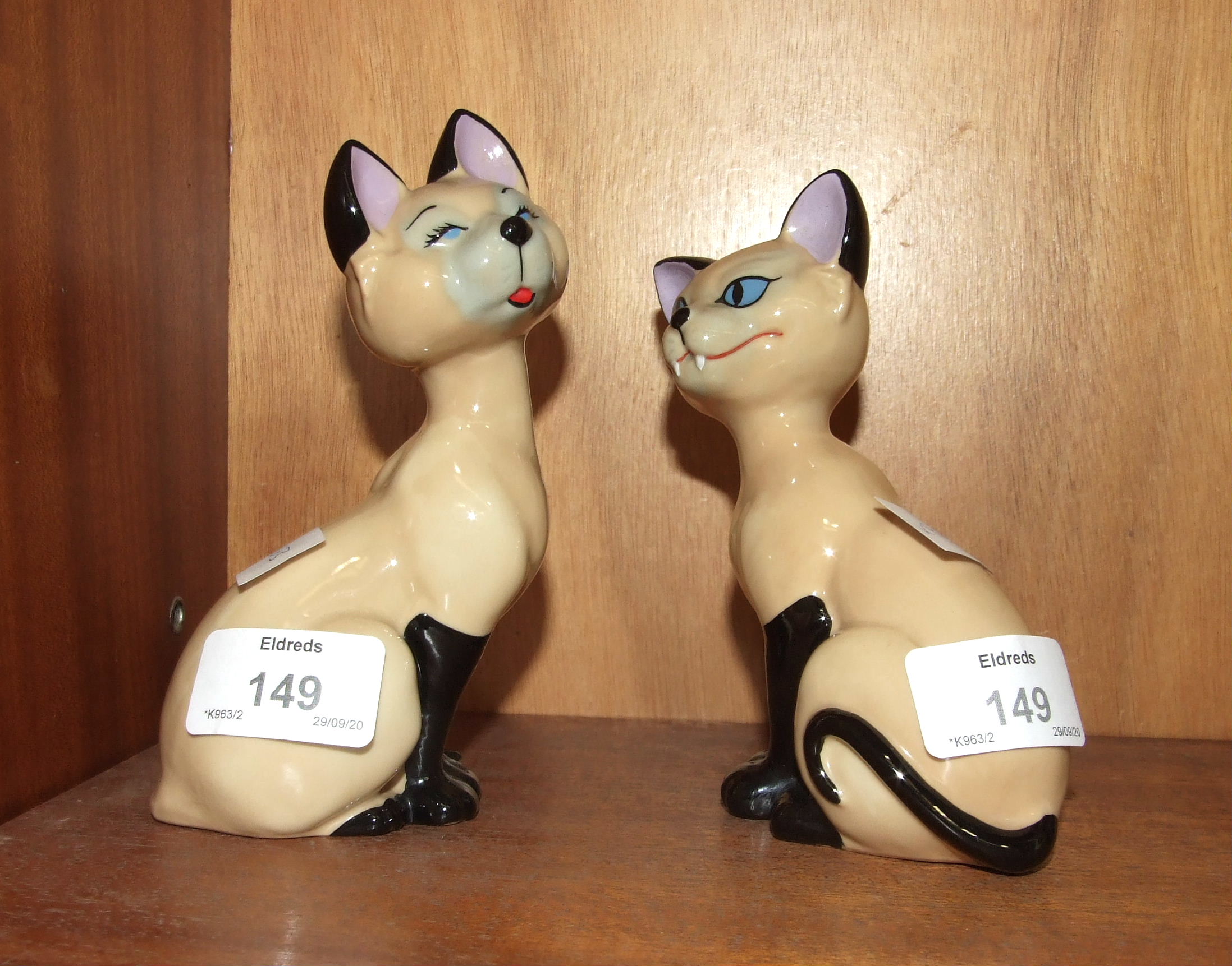 A pair of Wade Disney blow-up figures, 'Si' and 'Am', 14cm high, (2).