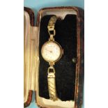 A lady's 9ct-gold-cased wrist watch, 21mm diameter, on plated bracelet, gross weight 16.8g.