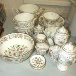 Sixteen pieces of Minton's 'Haddon Hall' ceramics, including a pair of vases with covers, 18cm high,