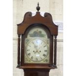 An early-19th century mahogany long case clock, the well-figured case enclosing the 13'' convex dial