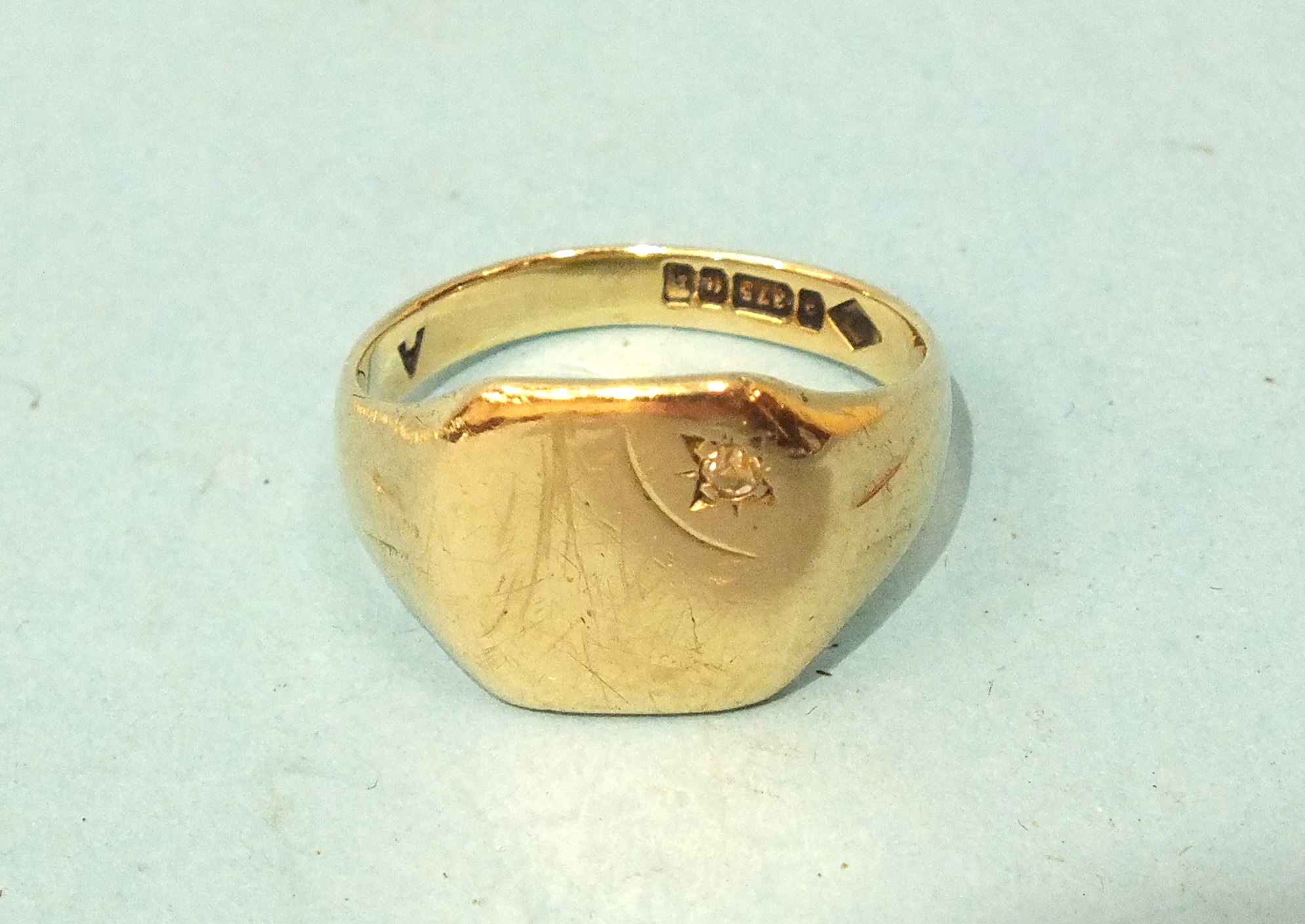A 9ct gold signet ring set diamond point, size N, 4g.