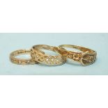 A 9ct gold buckle ring, size Q and two other 9ct gold rings, size M, total weight 4.5g.