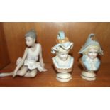 A pair of Continental painted ceramic busts of a girl and a boy in period costume, 14cm high and a