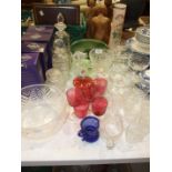 Three cut-glass decanters, five cranberry glass wine glasses, a cut-glass bowl, various sundae