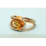 A 9ct gold ring collet-set an oval citrine, size Q, 3.7g.