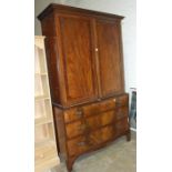 A Victorian mahogany chest of three long drawers and a linen press section, altered as a wardrobe,