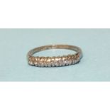 An 18ct gold half-hoop ring claw-set eight brilliant-cut diamonds, size N, 2.9g.