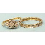 An 18ct gold cross-over ring set three 8/8-cut diamonds, size L, 2.4g and a 9ct gold eternity ring